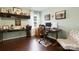 Bright home office with hardwood floors, natural light, a modern desk, and an adjustable office chair at 4808 Truscott Rd, Charlotte, NC 28226