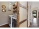 Well-organized laundry room with modern appliances, wooden shelves, and stylish accents at 4808 Truscott Rd, Charlotte, NC 28226