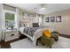 Comfortable main bedroom features a crystal chandelier and lots of natural light at 4808 Truscott Rd, Charlotte, NC 28226