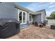 Brick patio features a grill and outdoor seating, perfect for relaxing at 4808 Truscott Rd, Charlotte, NC 28226