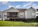Exterior of the home showcasing a screened porch, gray siding, and a well-maintained lawn at 5172 Norway Rd, Rock Hill, SC 29732