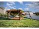 Backyard features a wooden pergola with a hammock and swing set area, great for outdoor enjoyment at 5172 Norway Rd, Rock Hill, SC 29732