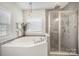 Bathroom features a large tub, standalone shower, and large window with natural light at 5172 Norway Rd, Rock Hill, SC 29732