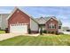 Charming single-Gathering home with brick and gray siding, well-manicured landscaping, and a two-car garage at 5172 Norway Rd, Rock Hill, SC 29732