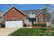 Charming brick and siding home with well-maintained lawn and two-car garage at 5172 Norway Rd, Rock Hill, SC 29732