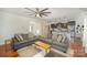 Open-concept living room with hardwood floors seamlessly connected to the modern kitchen at 5172 Norway Rd, Rock Hill, SC 29732