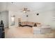 Spacious living room featuring a comfortable sectional couch and a decorative accent chair at 5172 Norway Rd, Rock Hill, SC 29732