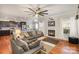 Stylish living room flowing into kitchen, featuring hardwood floors and a cozy fireplace at 5172 Norway Rd, Rock Hill, SC 29732