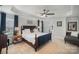 Spacious bedroom features tray ceiling, fan, large bed with side tables, and adjoining bathroom at 5172 Norway Rd, Rock Hill, SC 29732