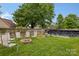 Backyard featuring a fire pit area surrounded by seating, adjacent to the in-ground pool at 5519 Burning Ridge Dr, Monroe, NC 28110