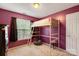 Fun bedroom with a loft bed, beanbag chair, and plum-colored walls at 5519 Burning Ridge Dr, Monroe, NC 28110