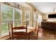 Cozy breakfast nook with ample natural light, table for four and views of the backyard at 5519 Burning Ridge Dr, Monroe, NC 28110