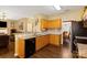 Well-lit kitchen featuring wood cabinets, granite countertops, and modern appliances at 5519 Burning Ridge Dr, Monroe, NC 28110