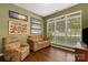 Cozy living room with hardwood floors, natural light, comfortable seating, and a relaxing atmosphere at 5519 Burning Ridge Dr, Monroe, NC 28110