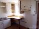 Kitchen with white cabinets, laminate countertops and a double basin sink at 605 W Elm St, Shelby, NC 28150