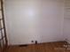 Bright living room with light hardwood floors offers simple elegance at 605 W Elm St, Shelby, NC 28150