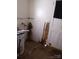 Damaged storage room with peeling wall, water heater and unfinished doorway needs repair at 605 W Elm St, Shelby, NC 28150