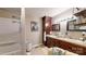 The bathroom features double sinks, plenty of vanity storage and a shower tub combo at 608 Forney Ave, Lincolnton, NC 28092