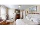 Bright bedroom with a decorative headboard and dark hardwood floors at 608 Forney Ave, Lincolnton, NC 28092