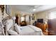 Comfortable bedroom features hardwood floors, ceiling fan, and a sitting area off the bedroom at 608 Forney Ave, Lincolnton, NC 28092