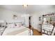 Comfortable bedroom with a full-sized bed, dresser, and hardwood floors at 608 Forney Ave, Lincolnton, NC 28092