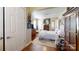 Bright bedroom featuring hardwood floors, a large closet, and a comfortable bed at 608 Forney Ave, Lincolnton, NC 28092