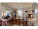 Elegant dining area with hardwood floors, chandelier, and a view into the living room at 608 Forney Ave, Lincolnton, NC 28092