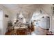 Charming dining room featuring a chandelier, hardwood floors, and view into the kitchen at 608 Forney Ave, Lincolnton, NC 28092