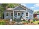Charming bungalow featuring a covered front porch, landscaped yard, and inviting curb appeal at 608 Forney Ave, Lincolnton, NC 28092