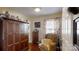 Cozy sitting area with dark wood floors and a comfortable chair at 608 Forney Ave, Lincolnton, NC 28092