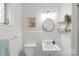 Classic white bathroom with unique sink and plenty of charm at 6100 Rose Valley Dr, Charlotte, NC 28210