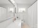 Clean bathroom showcasing a seamless sink, toilet, and bright white walls, creating a refreshing space at 6100 Rose Valley Dr, Charlotte, NC 28210