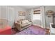 Cozy bedroom featuring a comfortable couch and colorful rug, perfect for relaxation and style at 6100 Rose Valley Dr, Charlotte, NC 28210