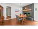 Charming dining room with a vintage fireplace, neutral paint, and wood floors at 6100 Rose Valley Dr, Charlotte, NC 28210