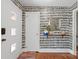 Stylish entryway with patterned wallpaper, hardwood floors, a colorful rug, and a round mirror at 6100 Rose Valley Dr, Charlotte, NC 28210