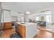 Bright, open kitchen with stainless steel appliances, a large island, and hardwood floors, perfect for modern living at 6100 Rose Valley Dr, Charlotte, NC 28210