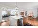 Open kitchen featuring an island with a sink and a view of the living and dining areas at 6100 Rose Valley Dr, Charlotte, NC 28210