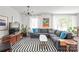 Bright living room with large windows, a comfortable sectional, and a striking black and white rug at 6100 Rose Valley Dr, Charlotte, NC 28210
