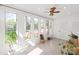 Well-lit sunroom featuring tile floors, and multiple large windows at 6100 Rose Valley Dr, Charlotte, NC 28210
