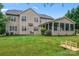 Beautiful home backyard with a screened porch and well maintained landscaping and lawn at 6312 Crosshall Pl, Waxhaw, NC 28173