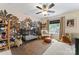 This Bedroom features an elegant crib with jungle-themed wallpaper and a modern ceiling fan at 6312 Crosshall Pl, Waxhaw, NC 28173