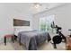 This bedroom features a blue quilt and decor with natural light coming through the window at 6312 Crosshall Pl, Waxhaw, NC 28173