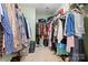This walk-in closet features hanging storage on both sides with light-green walls and carpet flooring at 6312 Crosshall Pl, Waxhaw, NC 28173