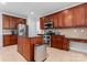 Spacious kitchen featuring stainless steel appliances, an island with granite countertop, and abundant cabinet space at 6312 Crosshall Pl, Waxhaw, NC 28173