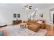 Cozy living room with a comfortable sectional couch and hardwood flooring at 6312 Crosshall Pl, Waxhaw, NC 28173