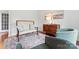 Cozy living room featuring a plush settee, decorative rug, and stylish wooden dresser with curated artwork at 6312 Crosshall Pl, Waxhaw, NC 28173