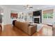 Inviting living area with a fireplace, plush couch, and open access to the kitchen at 6312 Crosshall Pl, Waxhaw, NC 28173