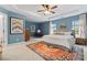 Spacious main bedroom features a tray ceiling, a king-size bed, and an area rug at 6312 Crosshall Pl, Waxhaw, NC 28173