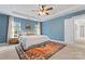 Serene main bedroom with a king-size bed, tray ceiling, and large windows for natural light at 6312 Crosshall Pl, Waxhaw, NC 28173