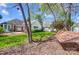 Large backyard featuring a hammock, patio, shed, and a lush lawn at 6420 Conifer Cir, Indian Trail, NC 28079